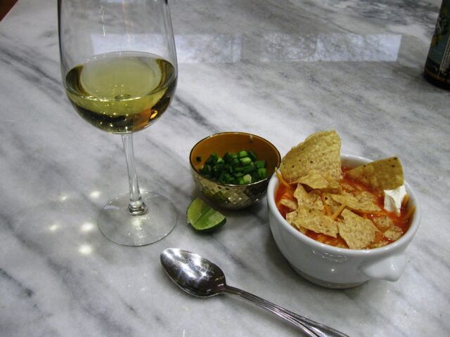 Chicken tortilla soup with a glass of chardonnay