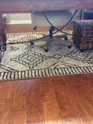 South by Silver rug by Orian sitting under the desk