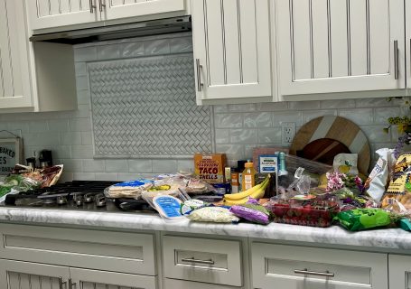 August Trader Joe's haul spread across a kitchen counter