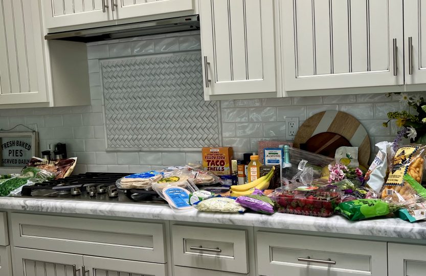 August Trader Joe's haul spread across a kitchen counter