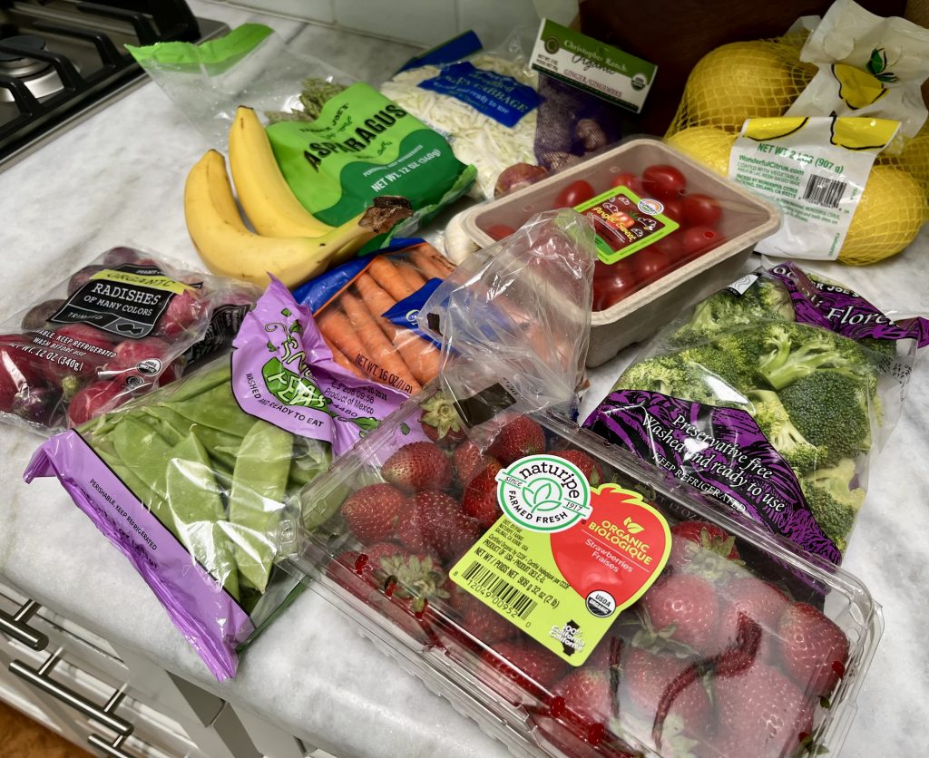 Fresh produce including strawberries, asparagus, lemons and vegetables from a Trader Joe's haul